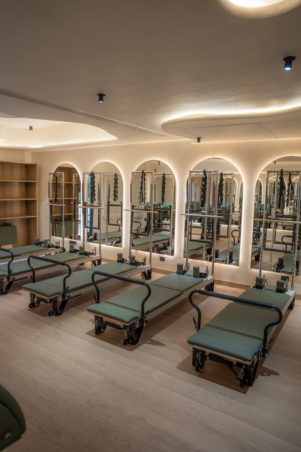 The O5 Pilates studio with arched mirrors and reformers